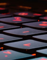 black keyboard keys with the letters in a red color